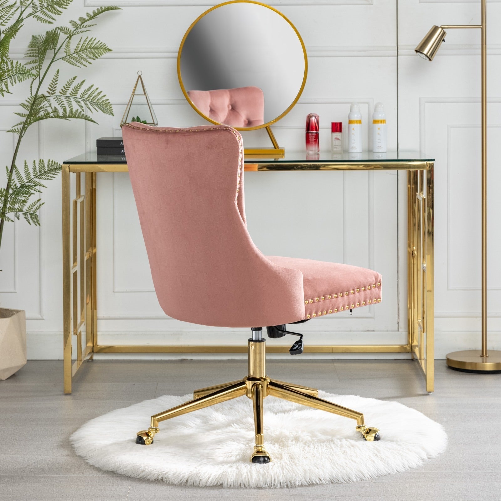 Velvet upholstered tufted chair with golden metal adjustable swivel base