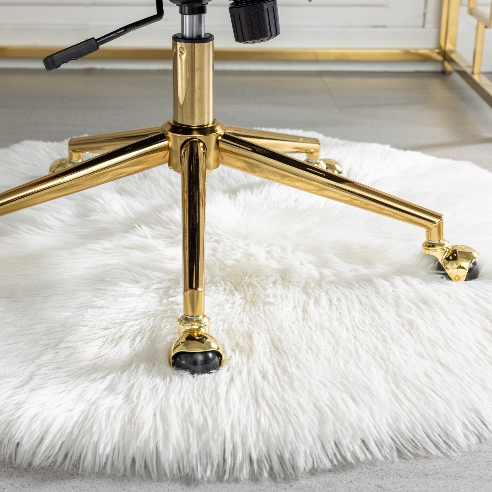 Velvet upholstered tufted chair with golden metal adjustable swivel base