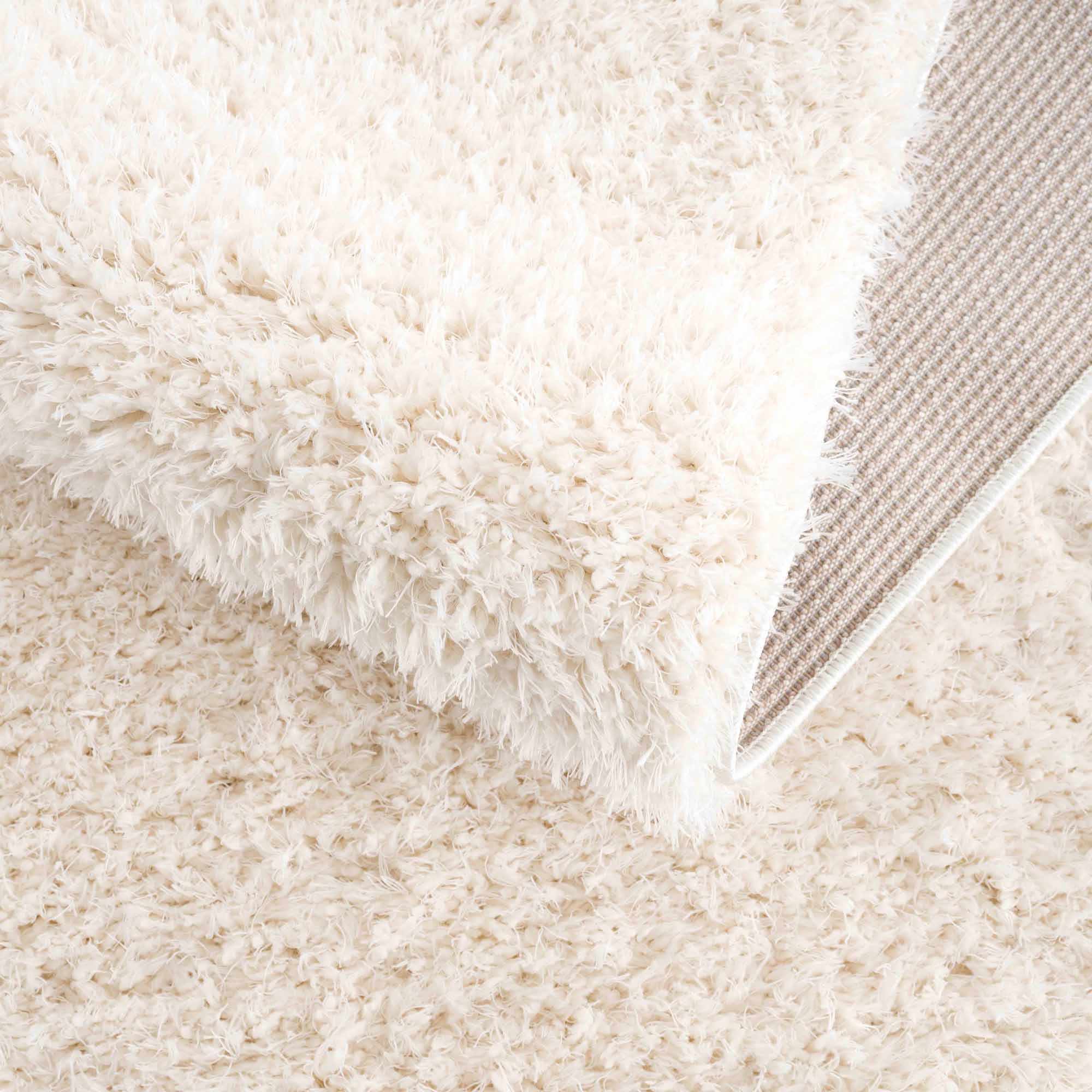 Faina Solid Cream Shag Washable Area Rug - Clearance