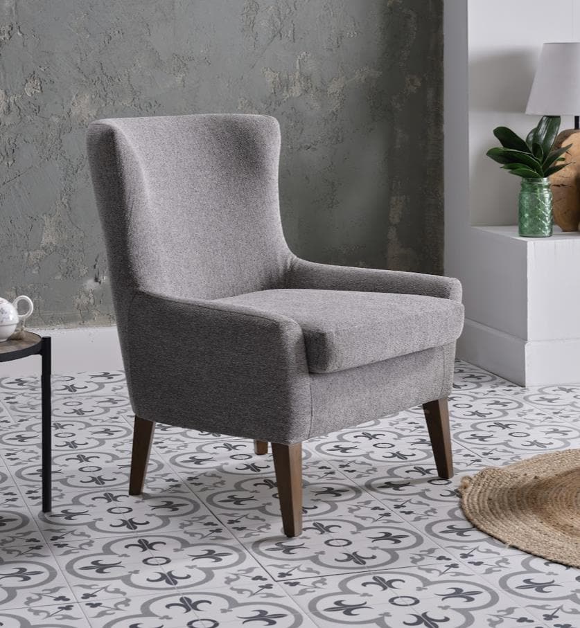 The Canyon Accent Chair with natural wood legs, providing a sophisticated touch to its modern design.