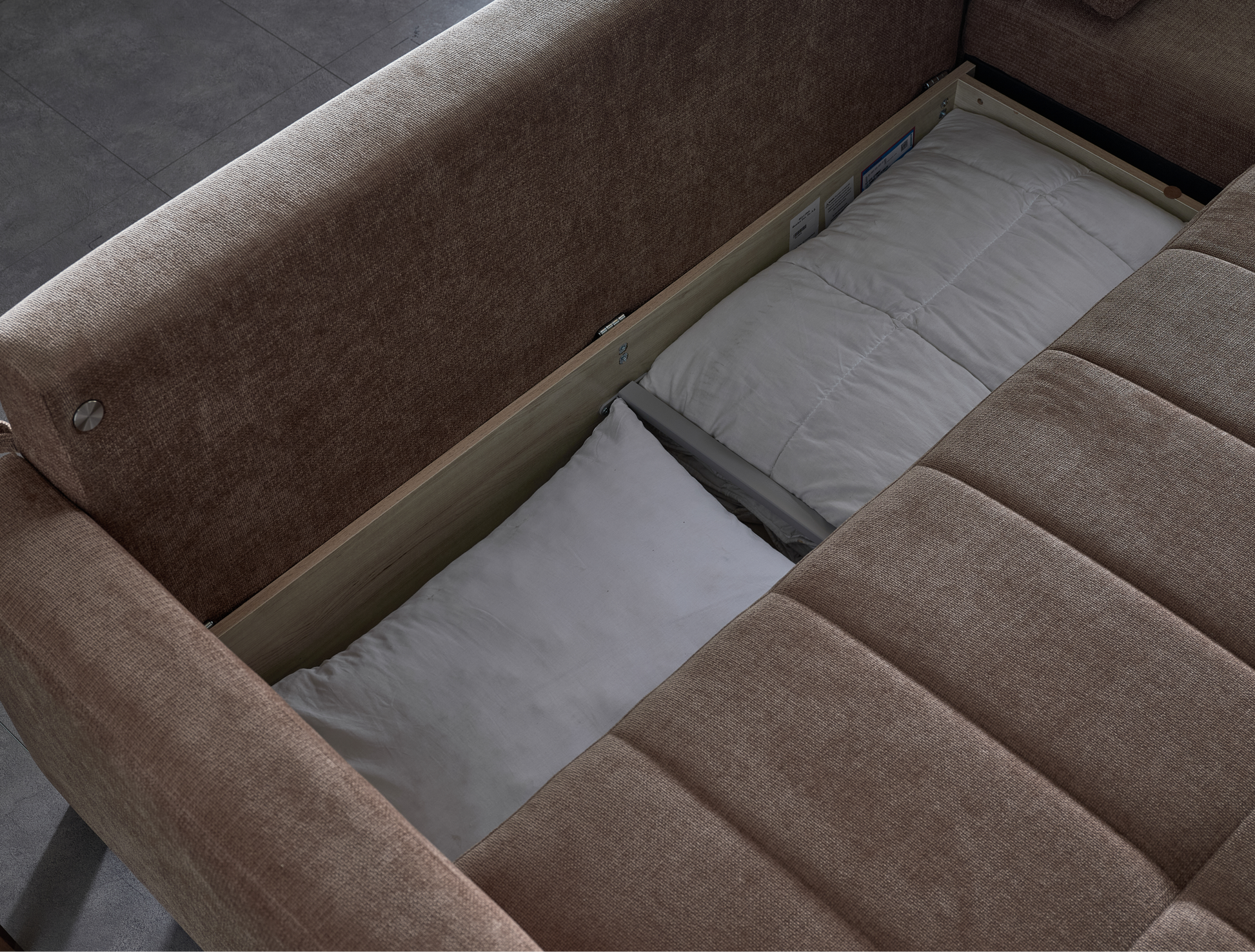 Modern IVY brown sectional with reversible chaise and queen sleeper bed for contemporary living.