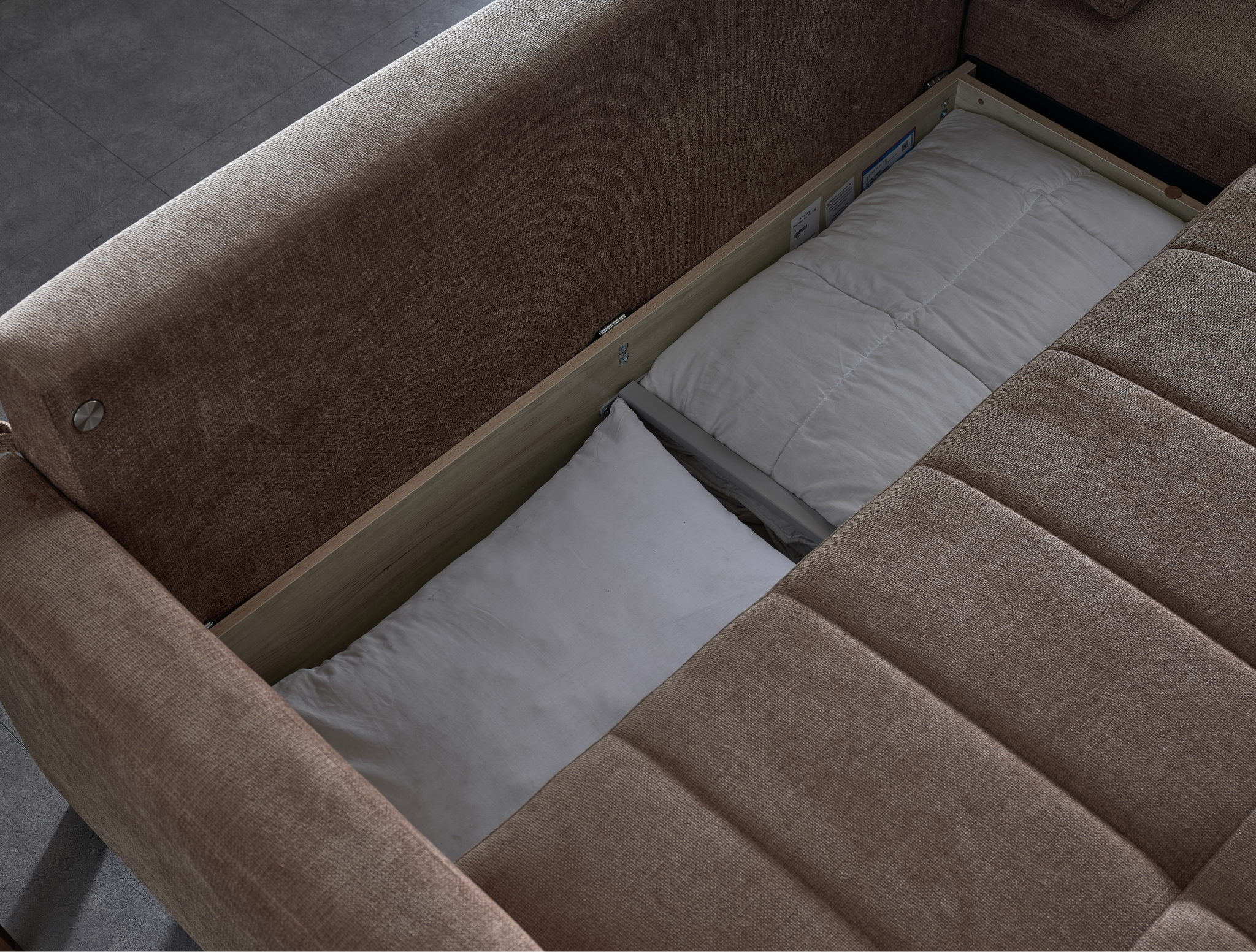 Modern IVY brown sectional with reversible chaise and queen sleeper bed for contemporary living.