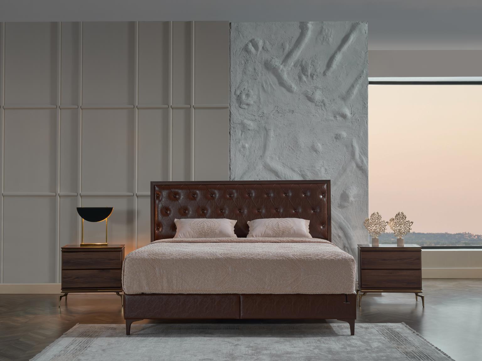 Close-up of the queen-size Montego headboard with button-tufted leather-like upholstery.