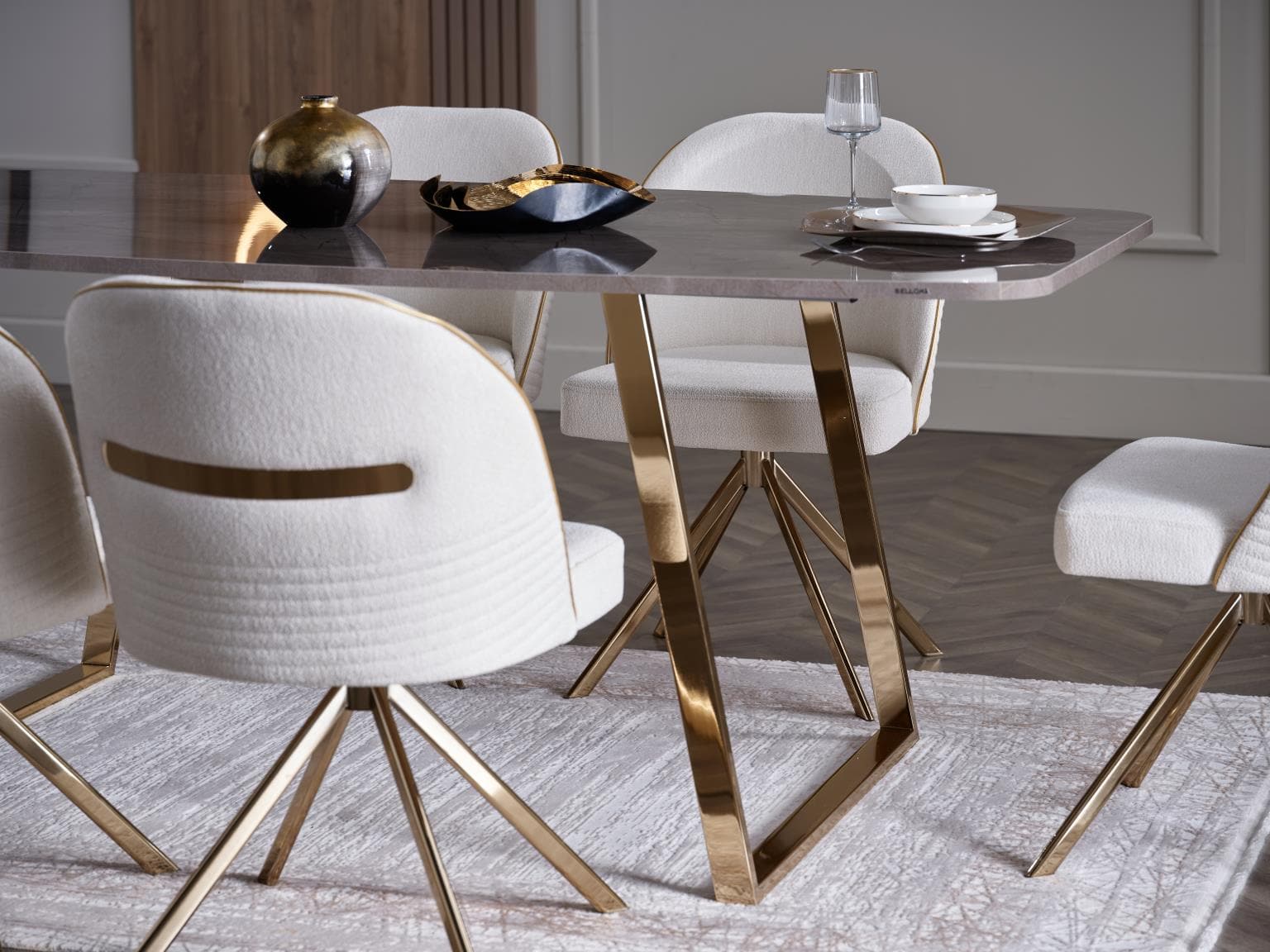 Set of two Veronica Dining Chairs with sleek metal legs and plush upholstery for a refined dining experience.